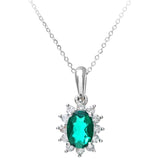 0.6ct Oval Emerald And 0.25ct Diamond Cluster Pendant In UK Hallmarked 9ct White Gold