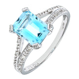 2ct Blue Topaz Emerald Cut Solitaire Split Shoulder Ring With Pave Set Side Stones In UK Hallmarked 9ct White Gold