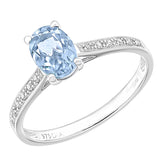 0.92ct Round Blue Topaz And Diamond Ring With Sidestones In UK Hallmarked 9ct White Gold